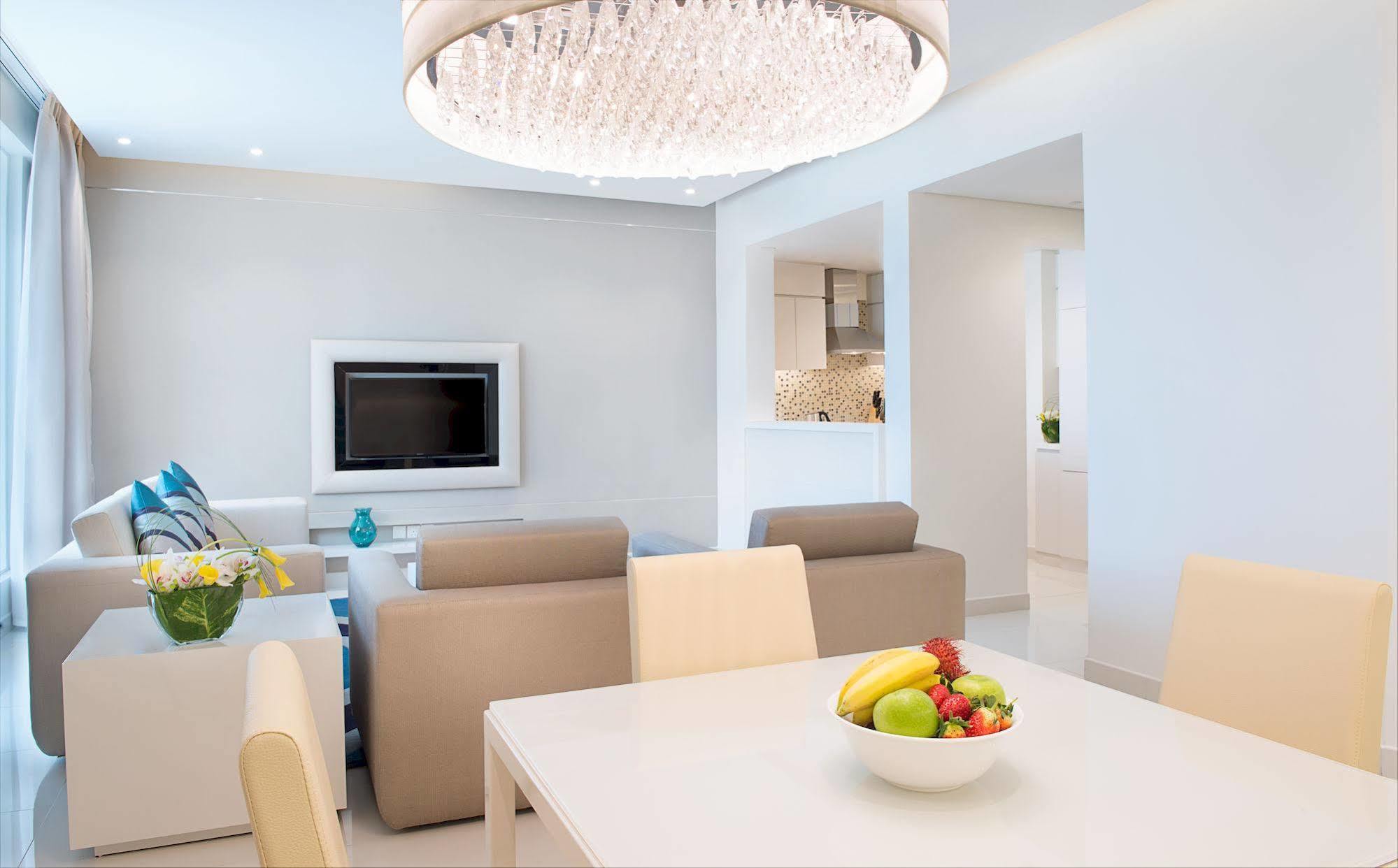 Damac Maison The Vogue Dubai Exterior photo A living room with a flat screen television