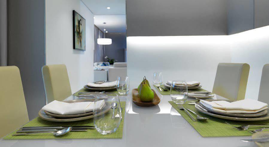 Damac Maison The Vogue Dubai Exterior photo A table set for a meal