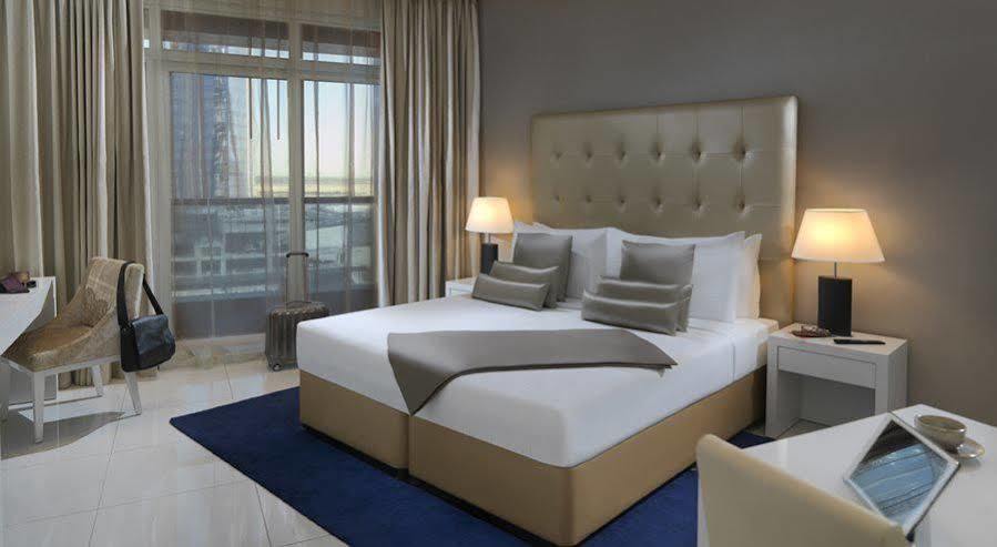 Damac Maison The Vogue Dubai Exterior photo A bedroom at the hotel